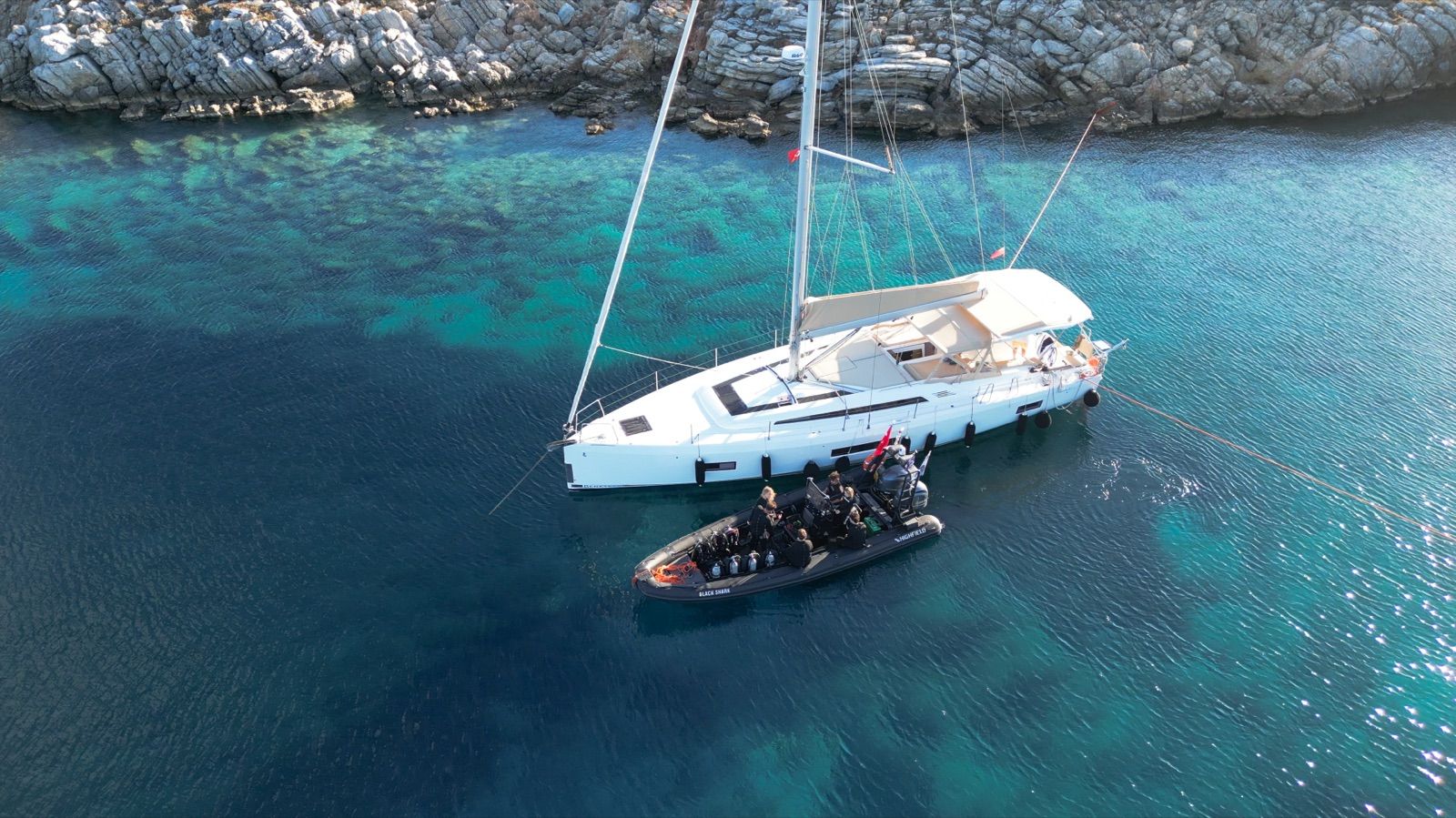 The Oceanis 51.1 at anchor with the Highfield RIB alongside: the two halves of the DiveTalia fleet